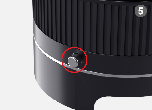 Pushing a button on the side, rotate counter-clockwise to remove the Extension Tube.  